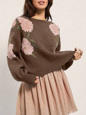 pullover sweater featuring floral in blush pink with 100% polyester Care instructions: Machine wash cold texture