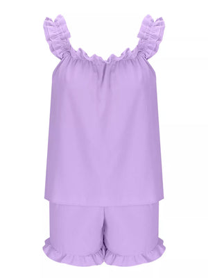 Ruffled two-piece pajama set in light purple polyester with ruffled neckline and leg openings.