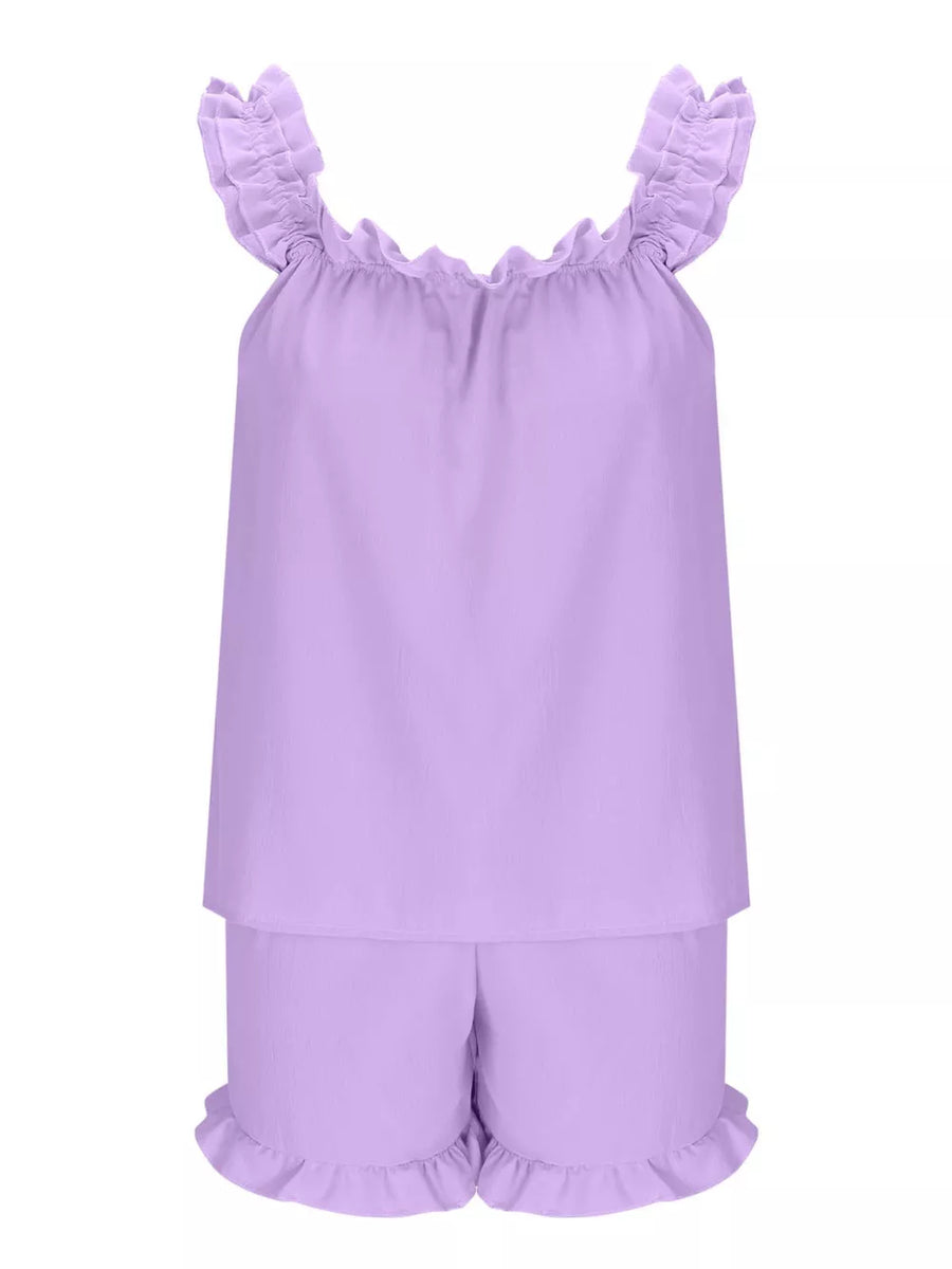 Ruffled two-piece pajama set in light purple polyester with ruffled neckline and leg openings.