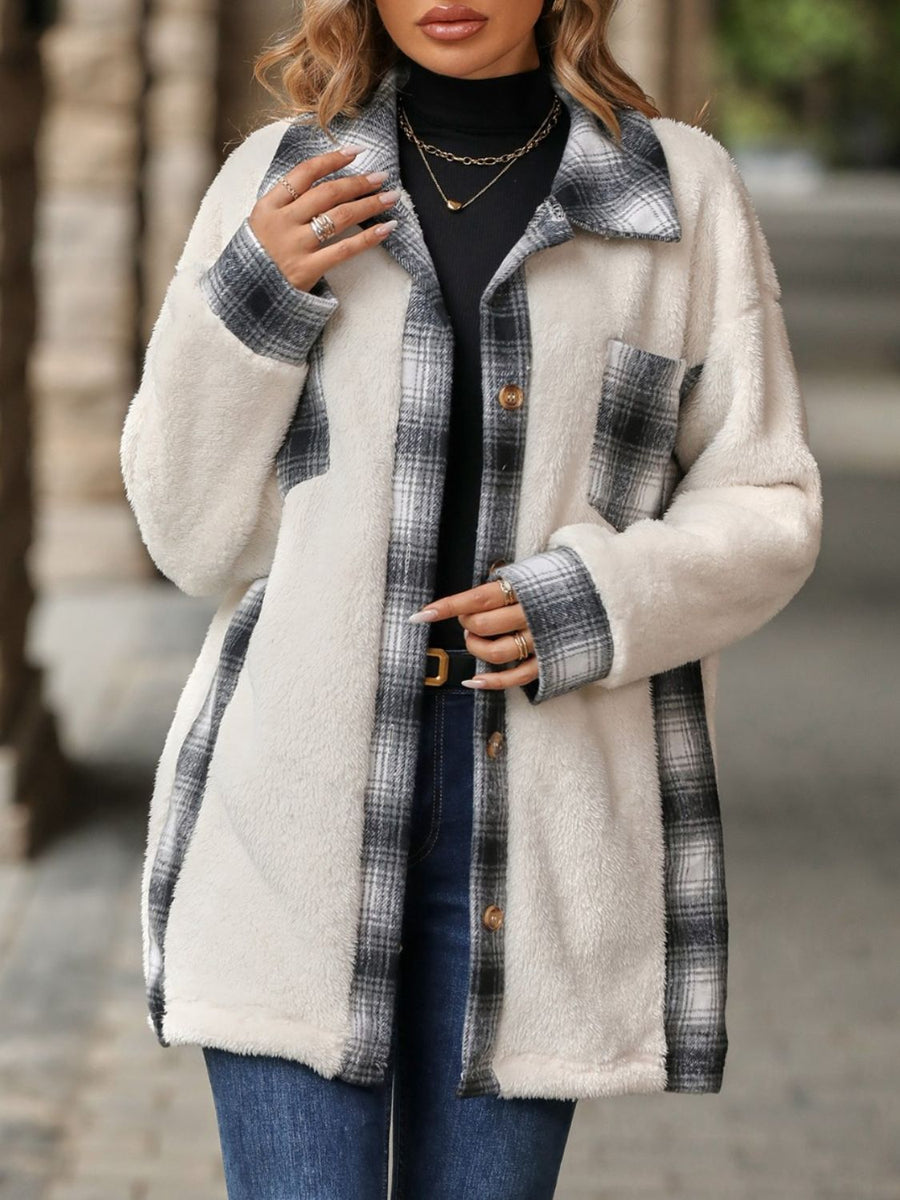 Teddy shacket with plaid accents and button front, featuring a fuzzy white exterior and gray plaid trim.