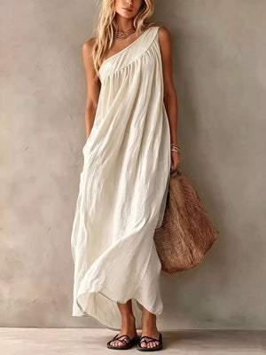 maxi dress in cream featuring one-shoulder and loose fit