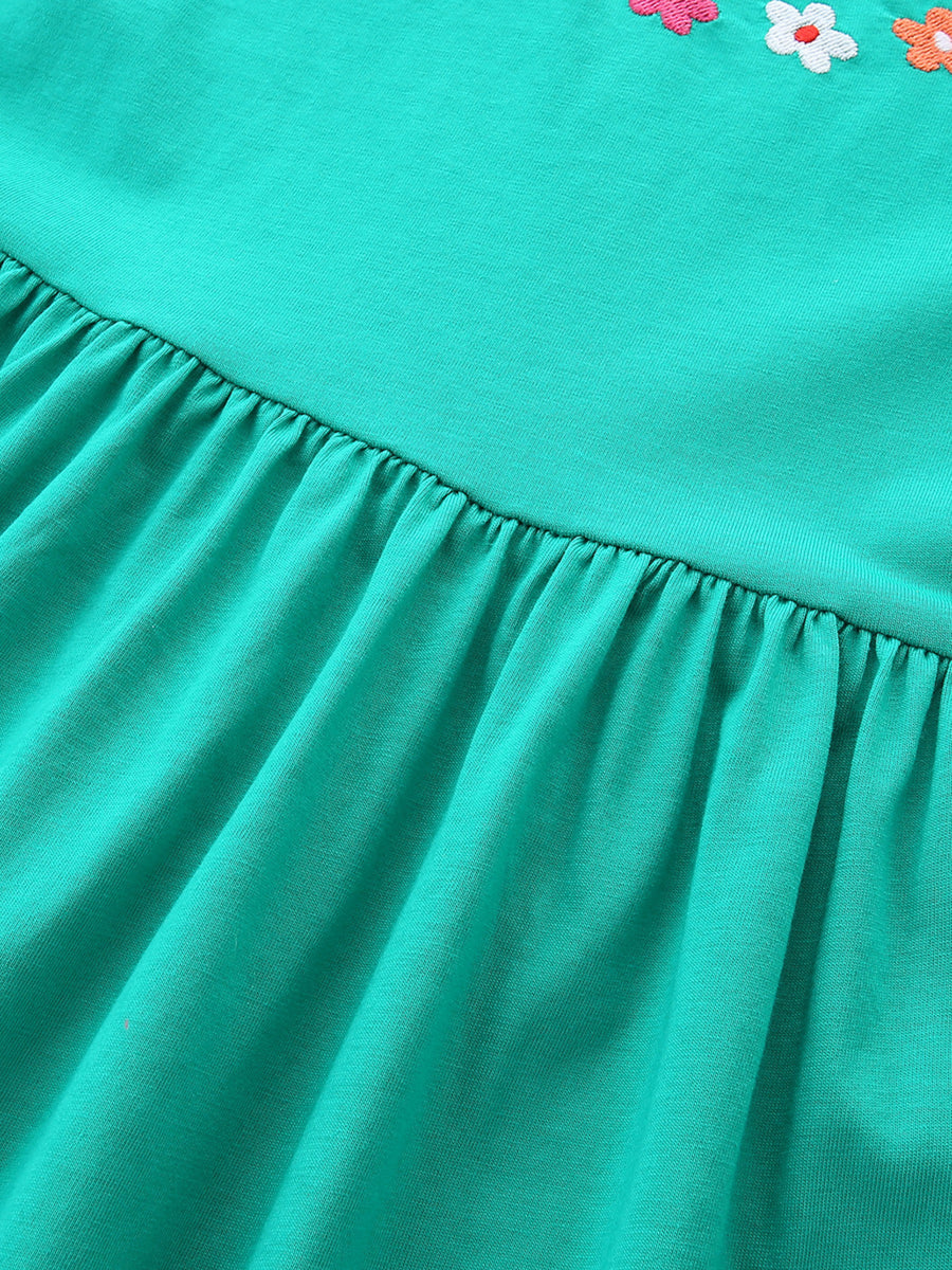 Turquoise A-line dress for kids with floral appliqué detail and gathered skirt.