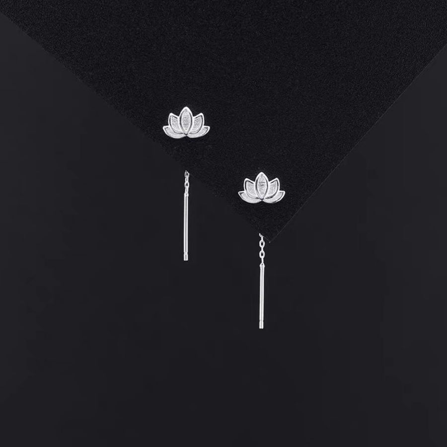 Silver earrings featuring dangle and floral