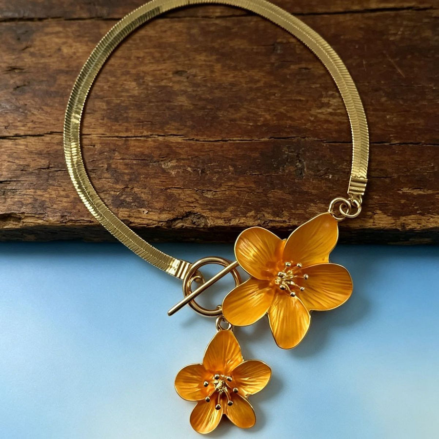 Gold anklet featuring flower charms and floral