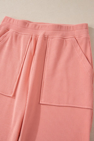 Pink ribbed pants with elastic waist and patch pockets