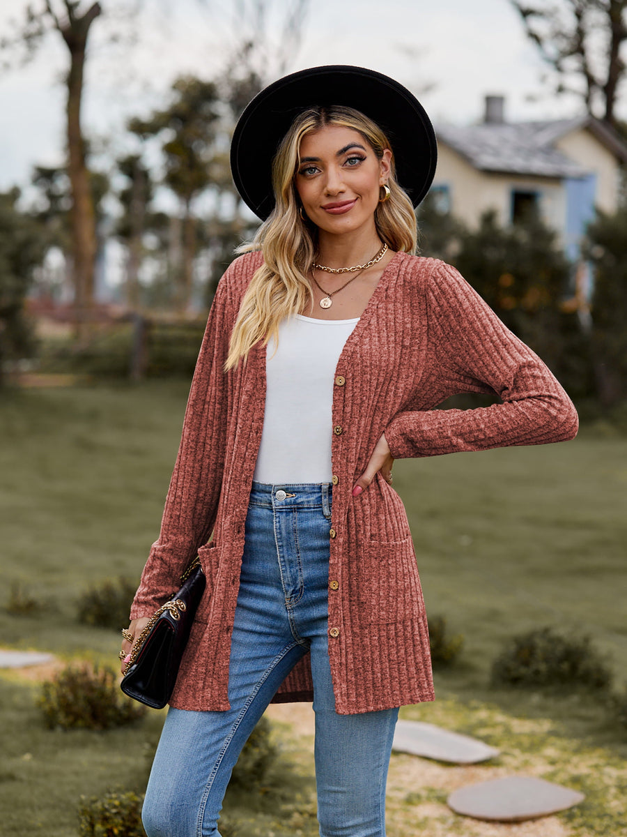 Longline ribbed knit button-down cardigan in rust with pockets and a relaxed fit.