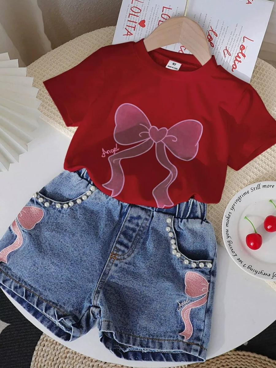 Scarlet tee with bowknot graphic and pearl-trimmed denim shorts with bowknot appliques.