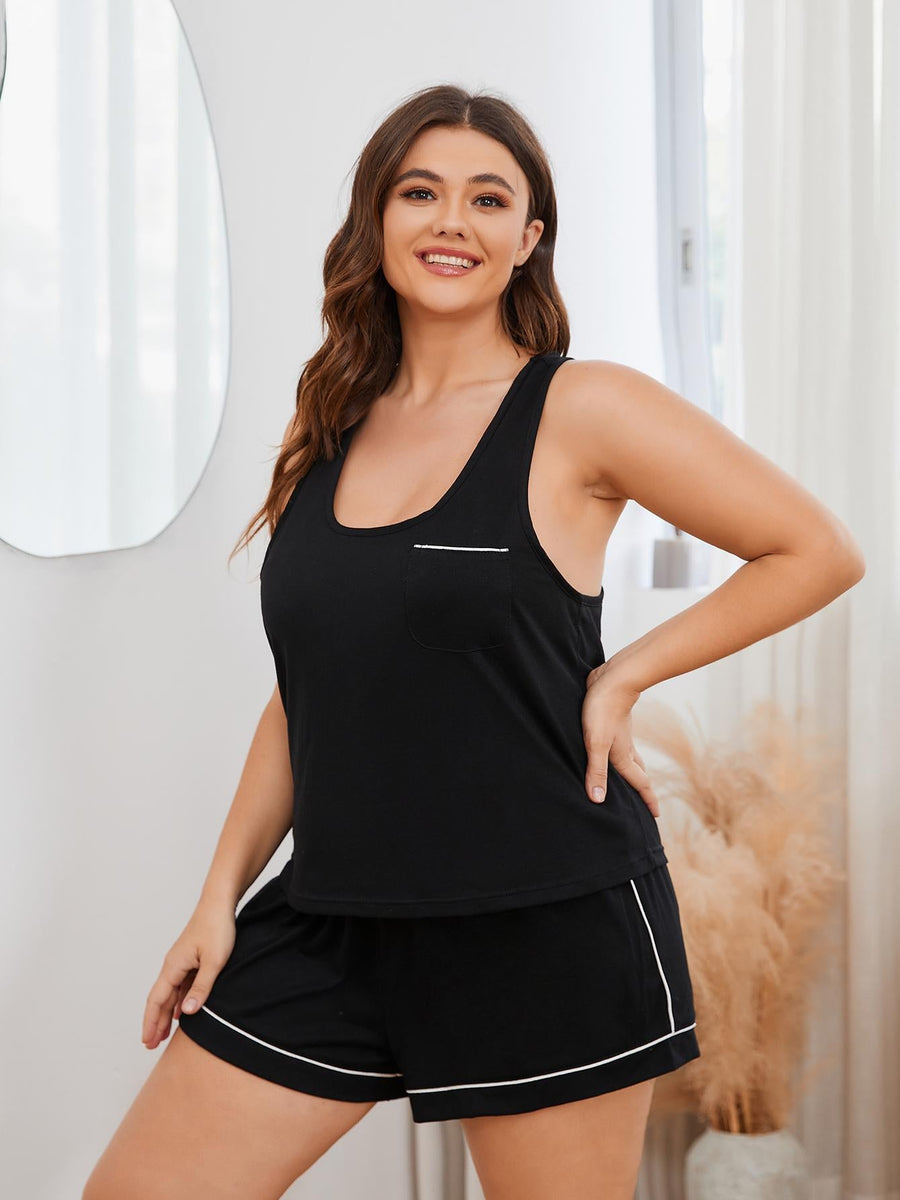 Black racerback lounge top with contrast trim and pocket, paired with matching shorts.