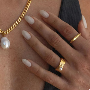gold ring with synthetic pearl accent and none