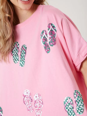 Pink polyester t-shirt with all-over sequin flip-flop print.
