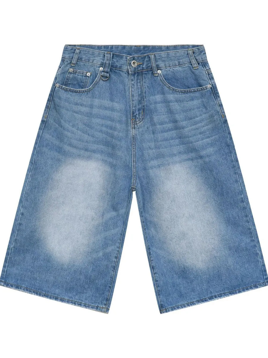 Light blue denim culottes with distressed detailing and wide legs.