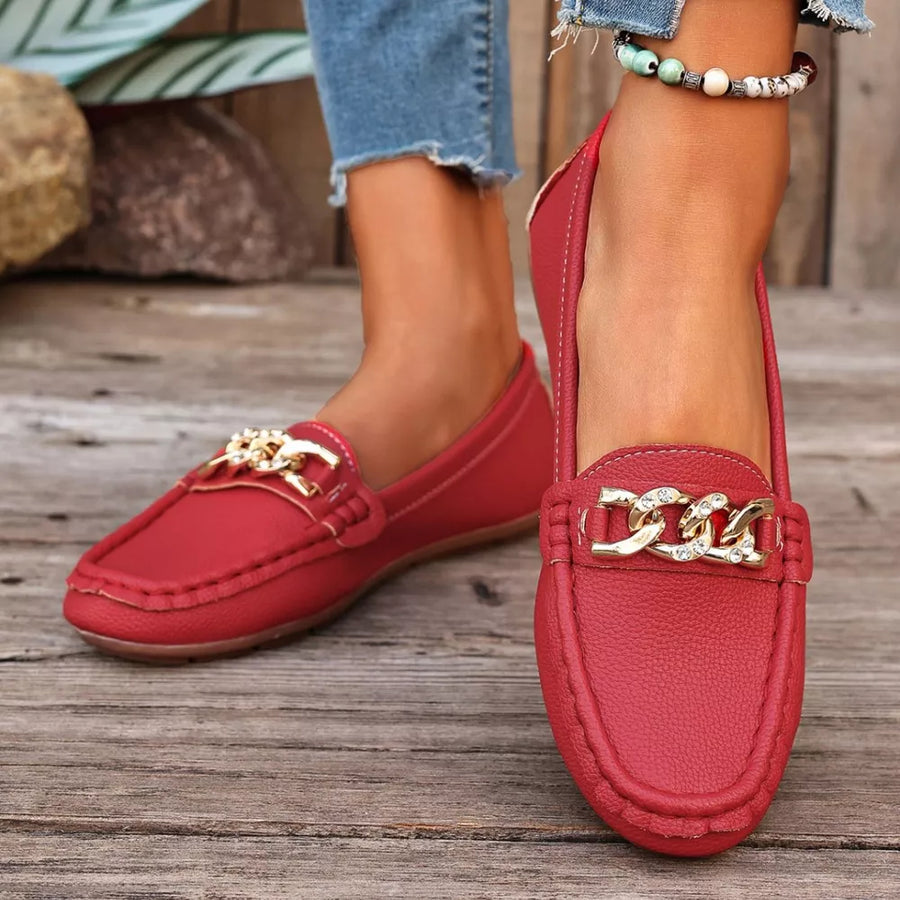 Red round-toe loafers with gold chain detail and stitching