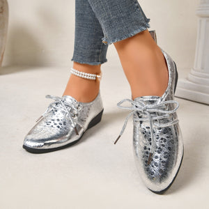 silver loafers featuring pointed toe and abstract-print