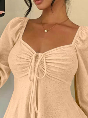 Black peplum top with pullover and eyelet