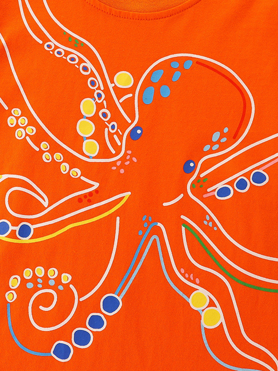 Orange cotton crew-neck t-shirt with a playful white outline octopus graphic and colorful polka dot accents.