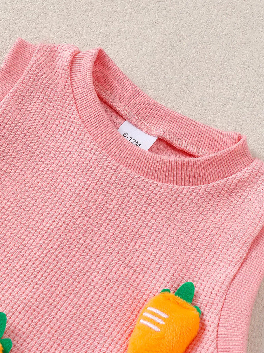 Pink waffle knit baby set with playful 3D carrot appliqués.