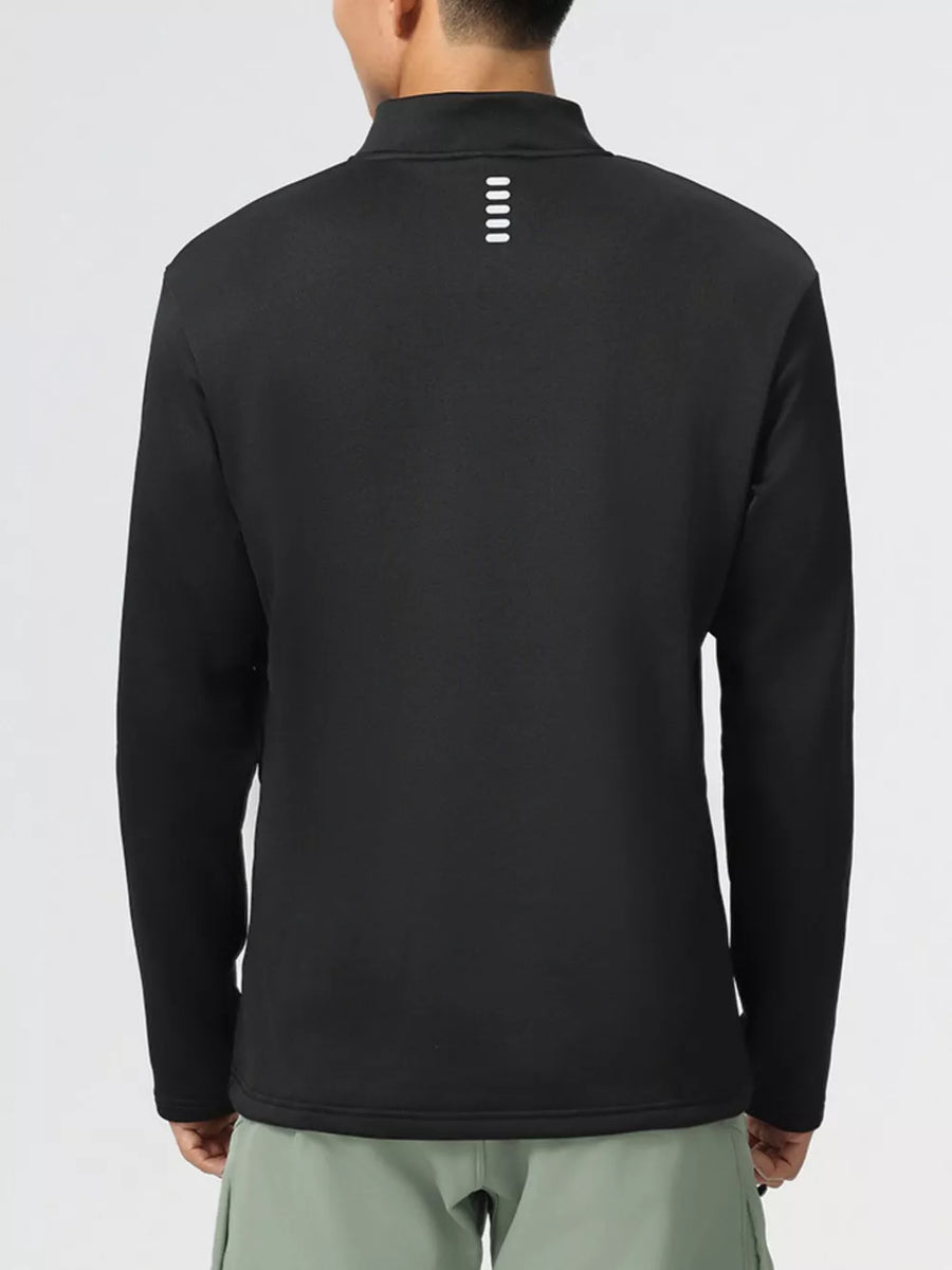 Black half-zip activewear sweatshirt with reflective stripe detail on back.