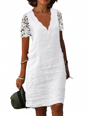 mini dress in white featuring lace detail and relaxed fit