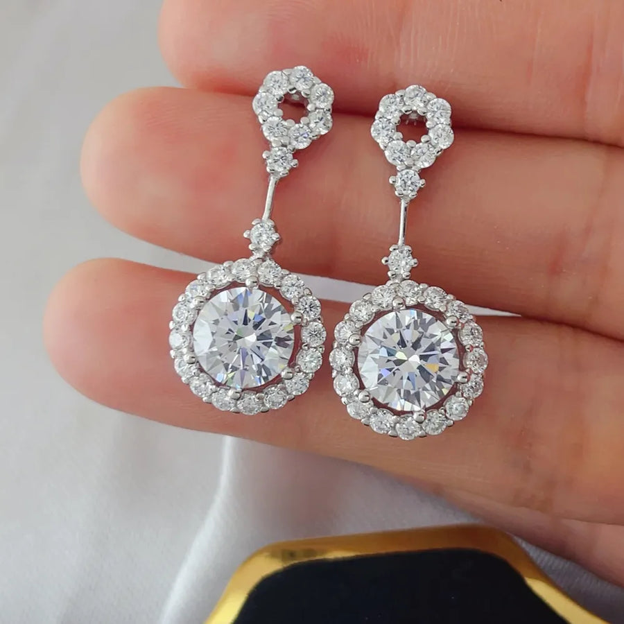earrings in clear with drop design and dangle
