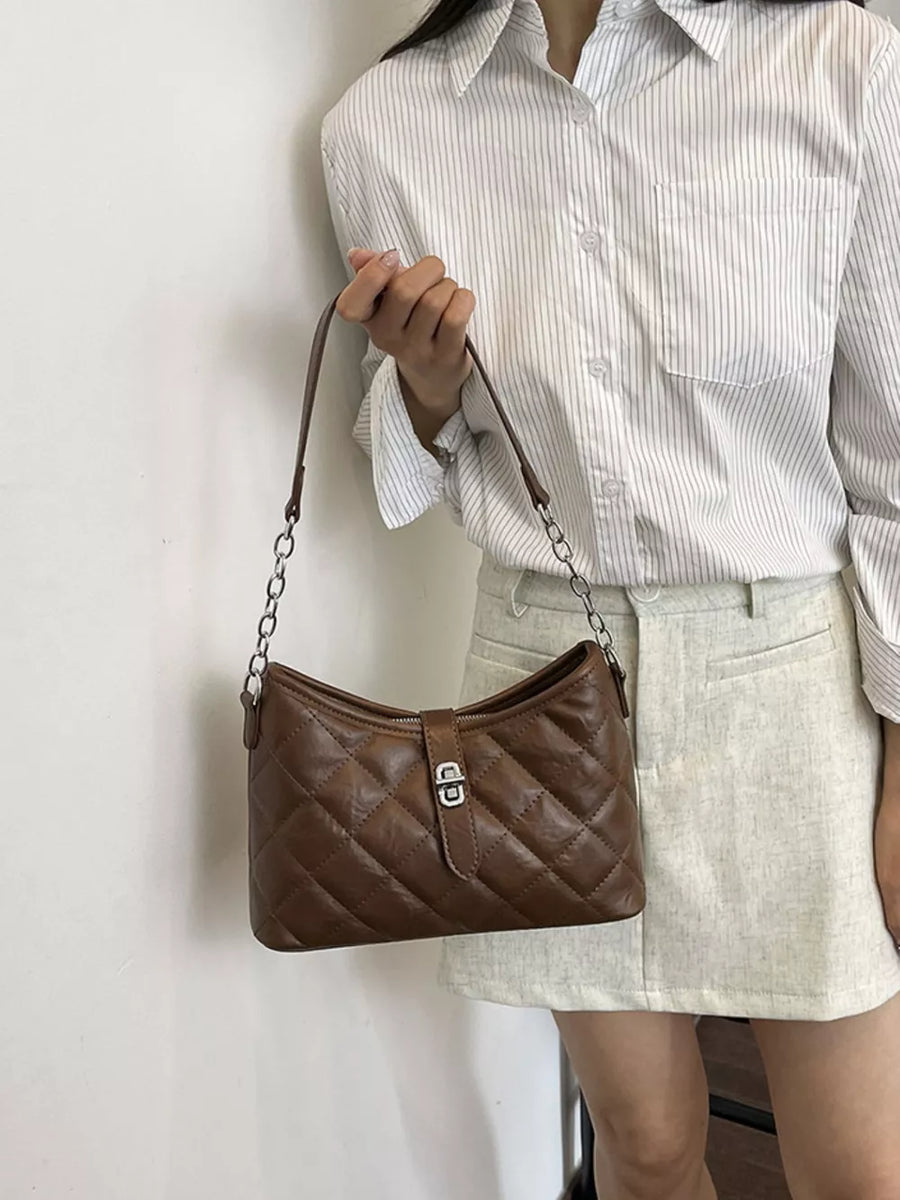 crossbody bag featuring quilted in Brown with PU Leather Imported Size & texture