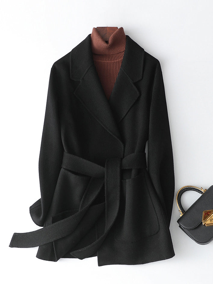 wool coat in black featuring pocketed and regular fit