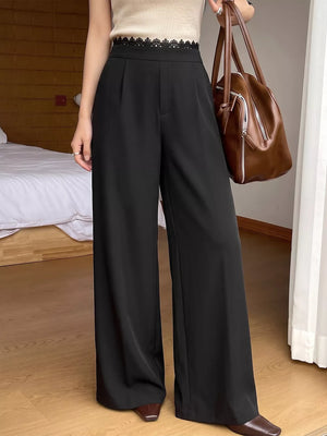 97% polyester, 3% elastane Care instructions: Machine wash cold wide-leg pants in Black with flared silhouette
