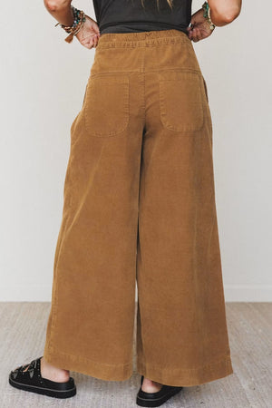 Camel wide-leg pants featuring elastic waist and ribbed