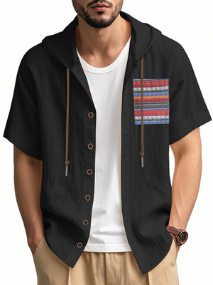 Black hooded short sleeve shirt with patterned chest pocket and button front.