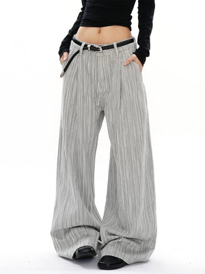 Men's grey striped wide-leg sweatpants with a black belt and pleats.