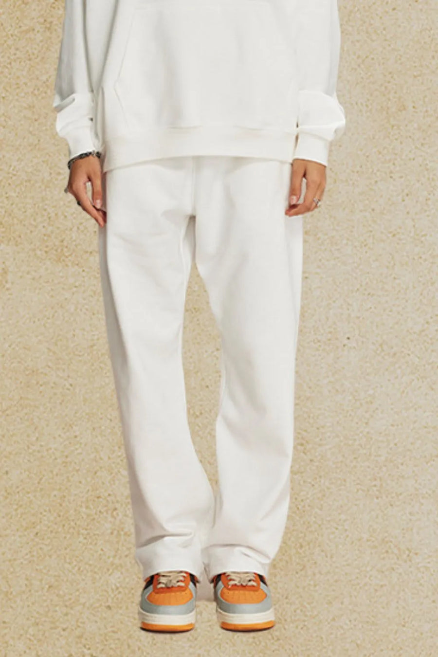 Relaxed fit white joggers with a straight leg cut.