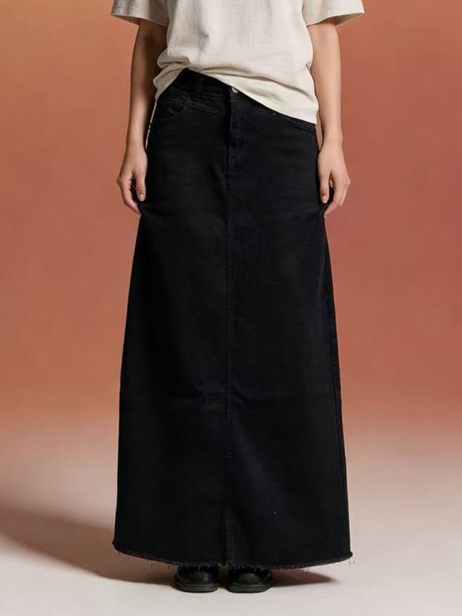 Black denim maxi skirt with raw hem and button closure