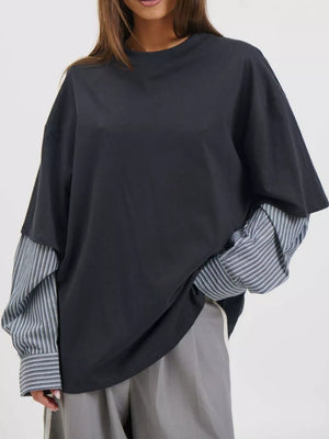 white t-shirt featuring layered and striped