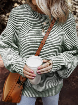 Relaxed ribbed knit boat neck sweater in stripe with a comfortable fit.