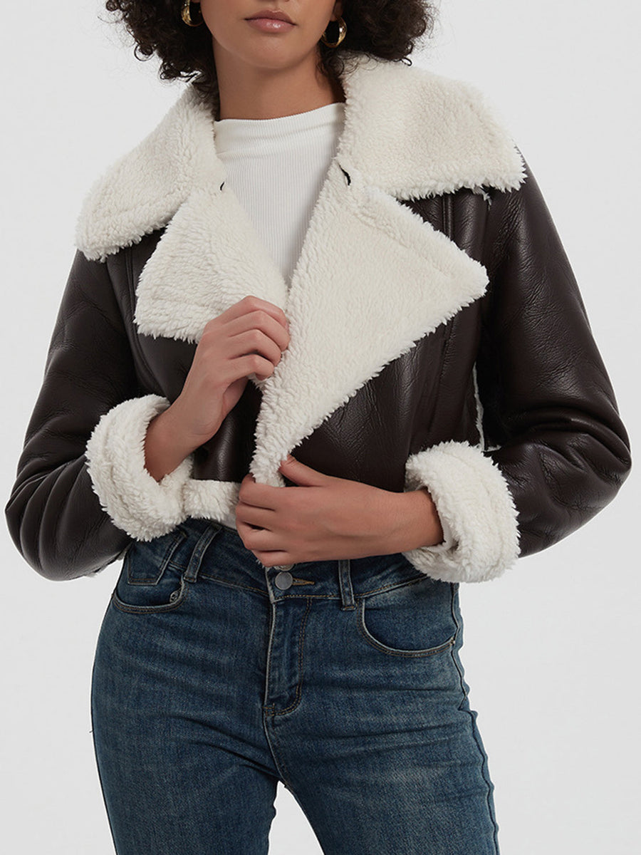 Brown cropped aviator jacket with white shearling trim and collar.