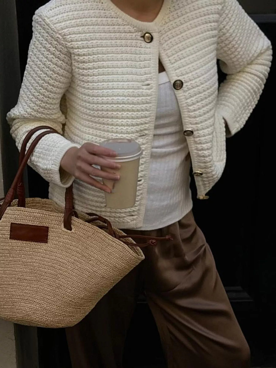 Textured button-down cardigan in gray/white with gold buttons, worn over a white tank top.