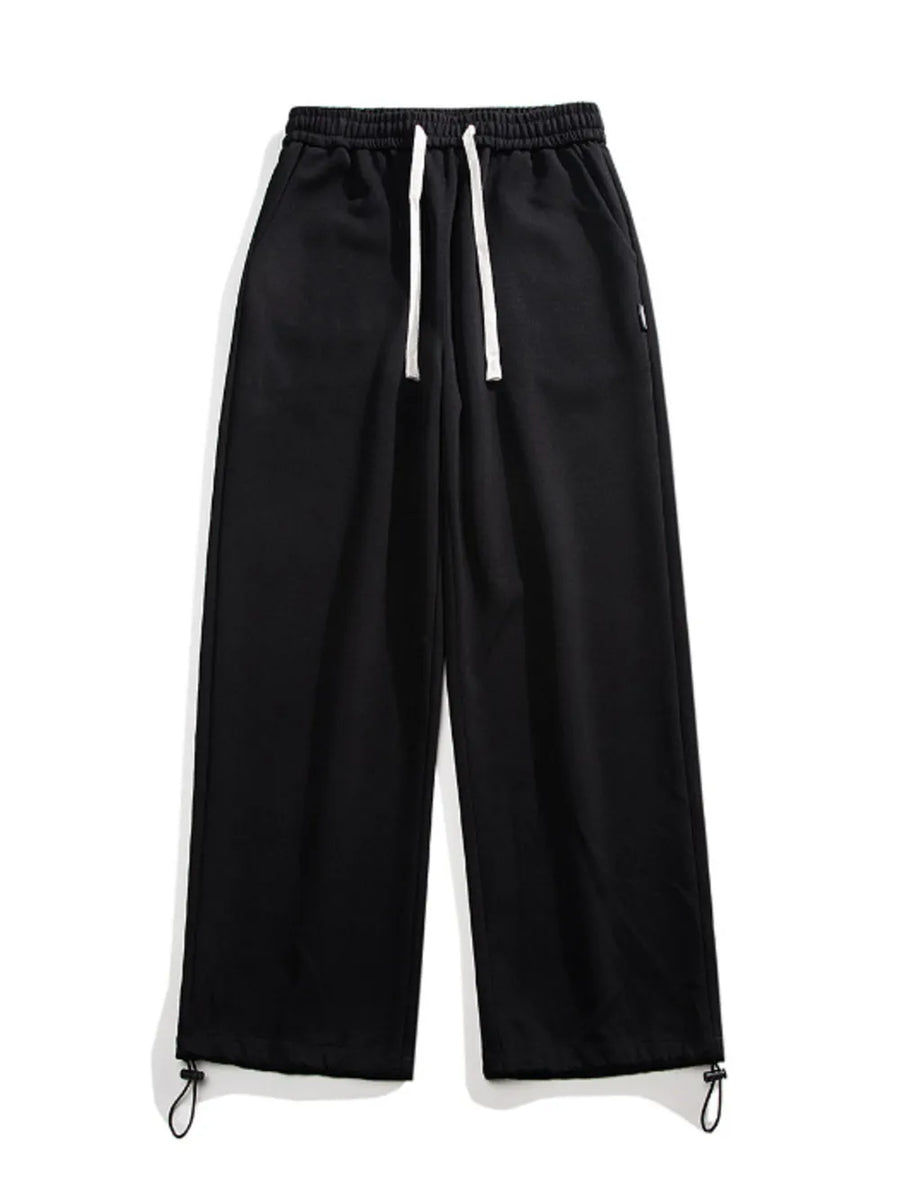 Black relaxed fit drawstring wide-leg sweatpants with adjustable ankle cuffs.