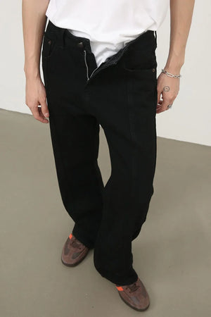 Black panel seam flare jeans with a zipper fly and a relaxed fit.