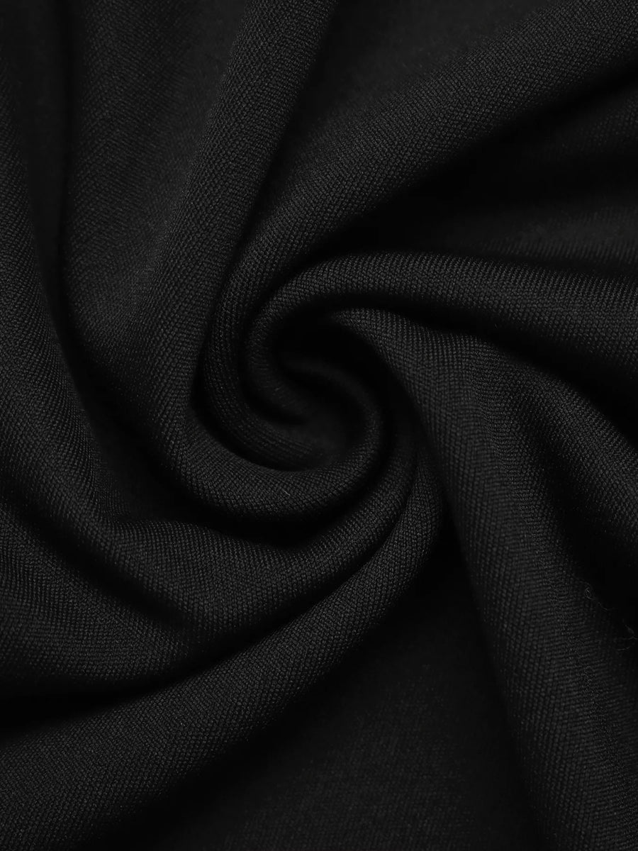 Black midi skirt with button front detail and textured fabric.