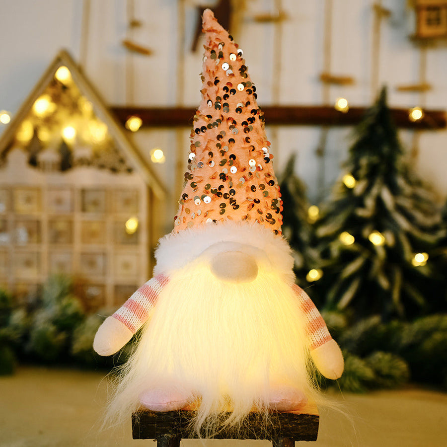 Light-Up Sequin Gnome Trio in blush pink with white fluffy beard and striped sleeves.