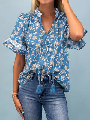 Blue floral cotton blouse with ruffle sleeves and tassel tie neckline