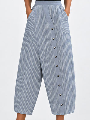 white wide-leg pants featuring decorative button and striped
