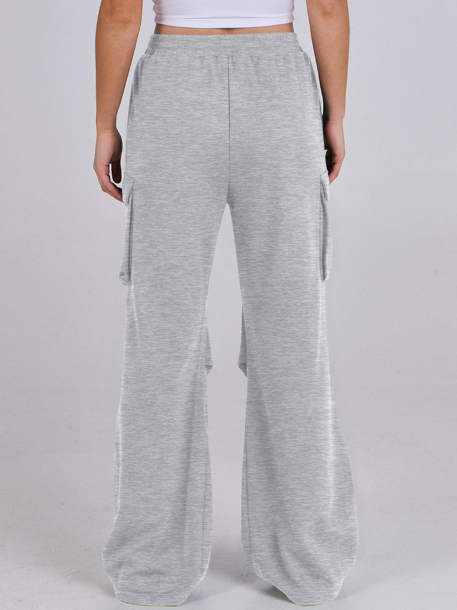 Light gray sweatpants with cargo pockets and wide legs.