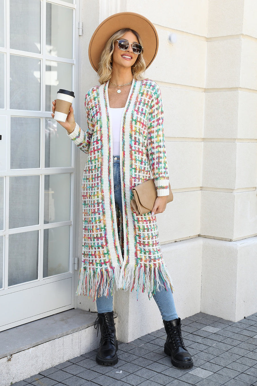 Chromatic crochet maxi cardigan with fringe detail and colorful woven pattern.