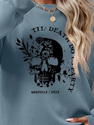 Air Force Blue raglan sweatshirt with floral skull graphic and text.