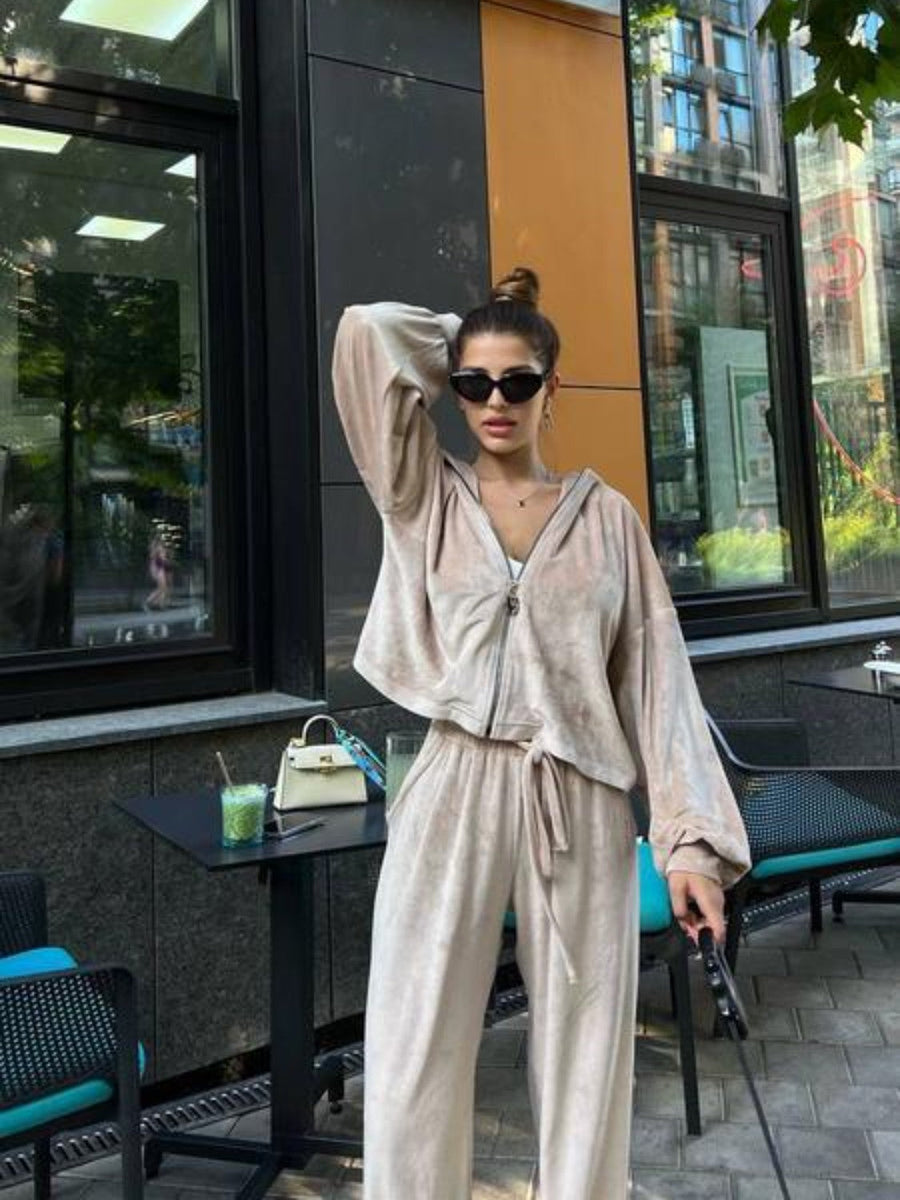 Plush velour lounge set in Sand, featuring a zip-up hoodie and wide-leg pants with drawstring.