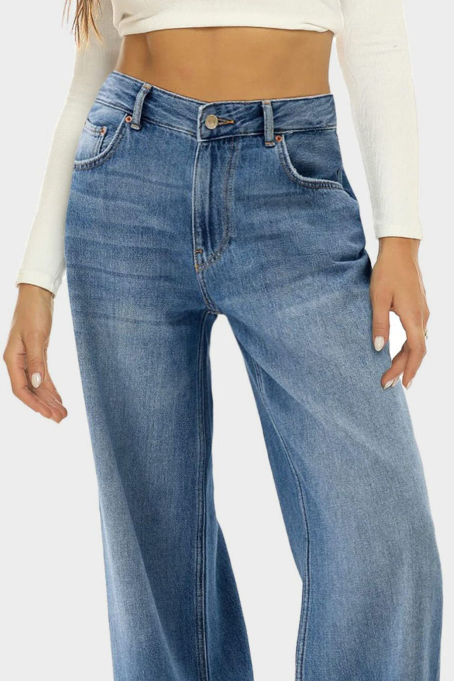 Wide-leg denim jeans in Dusty Blue with a subtle fade and button closure.