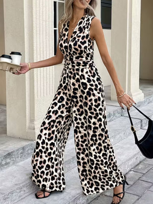 Chic sleeveless leopard print romper with V-neck and wide legs.