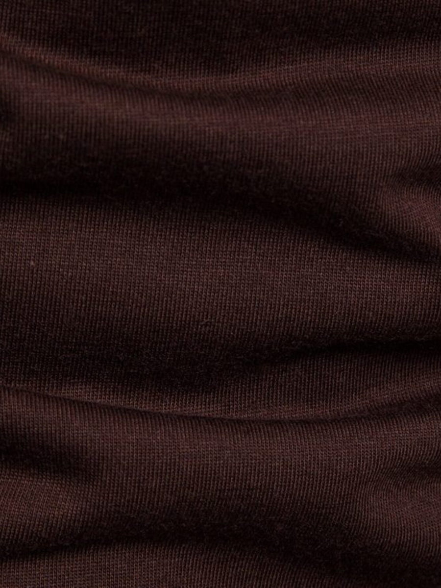 Brown cotton t-shirt with ribbed texture and asymmetric hem detail.