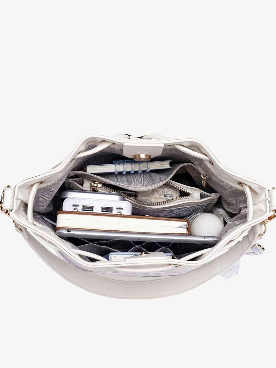 crossbody bag featuring geometric in light purple with PU Leather Imported Size & texture