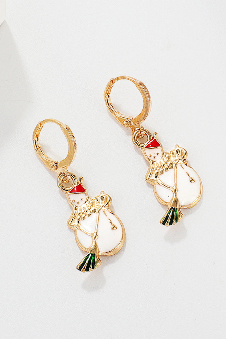 Festive Santa charm hoop earrings with white snowman and red hat, gold alloy.